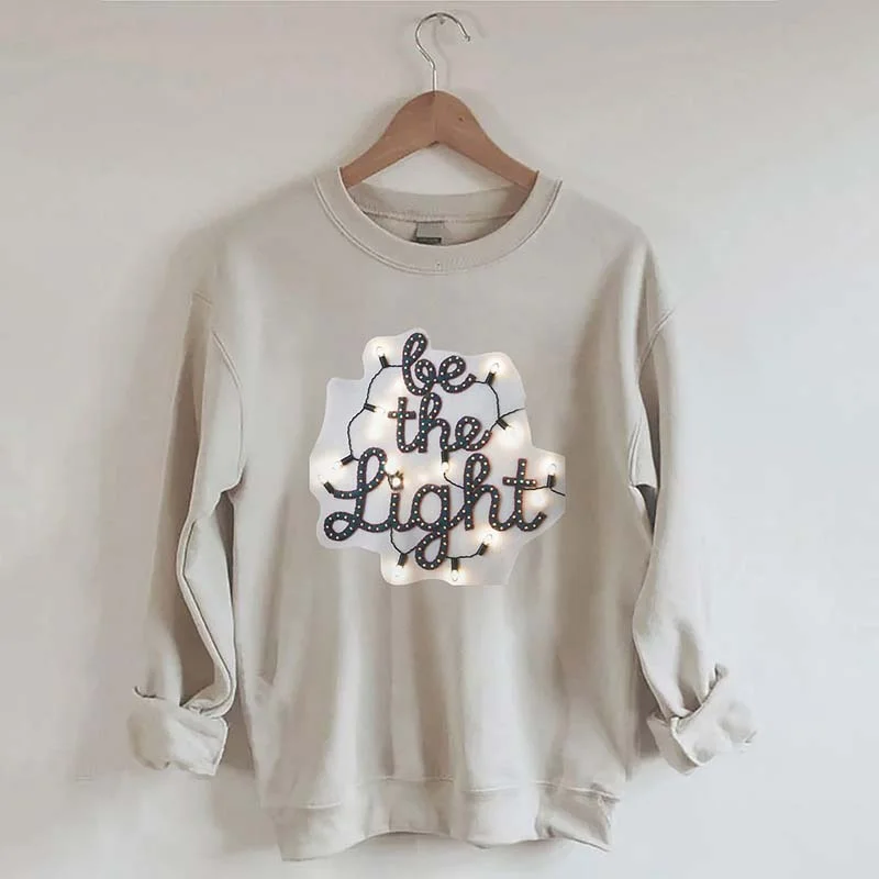 Sweatshirts with brass buttons -Be the Light Felt Embroidery Christmas Lights Sweatshirt